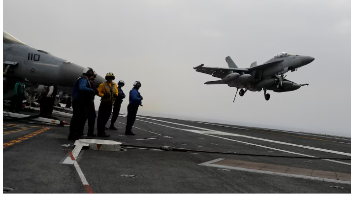 An F/A-18 fighter jet lands on the USS Harry S. Truman aircraft carrier in the eastern Mediterranean Sea, May 4, 2018. REUTERS/Alkis Konstantinidis/File Photo Purchase Licensing Rights