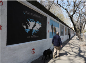 A man walks past murals depicting the Falkland Islands, known in Argentina as the Islas Malvinas, commemorating the 1982 war between Britain and Argentina over the Falklands, in Buenos Aires, Argentina, September 15, 2026. REUTERS/Alessia Maccioni