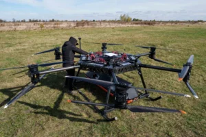 A representative of the SkyFall drone company checks the StarGate drone before a demonstration flight at an undisclosed location in Ukraine, Wednesday, Oct. 14, 2026. (AP Photo/Evgeniy Maloletka) CORRECTION: Corrects name of drone to StarGate instead of SkyGate License this photo